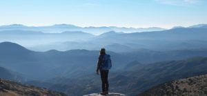 Image of someone looking out at mountains